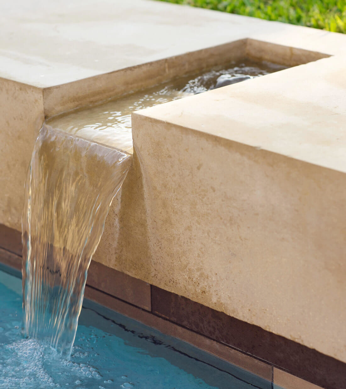 Forest-Court-Water-Feature-Custom-Pool-Hardscape-Detailing-Bonick-Landscaping