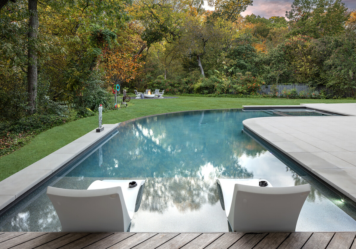 Ledge Loungers overlooking curved negative edge pool