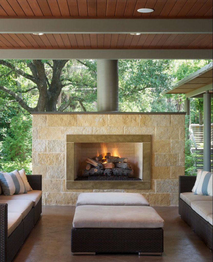 Award-winning contemporary limestone outdoor fireplace design - Dallas, TX