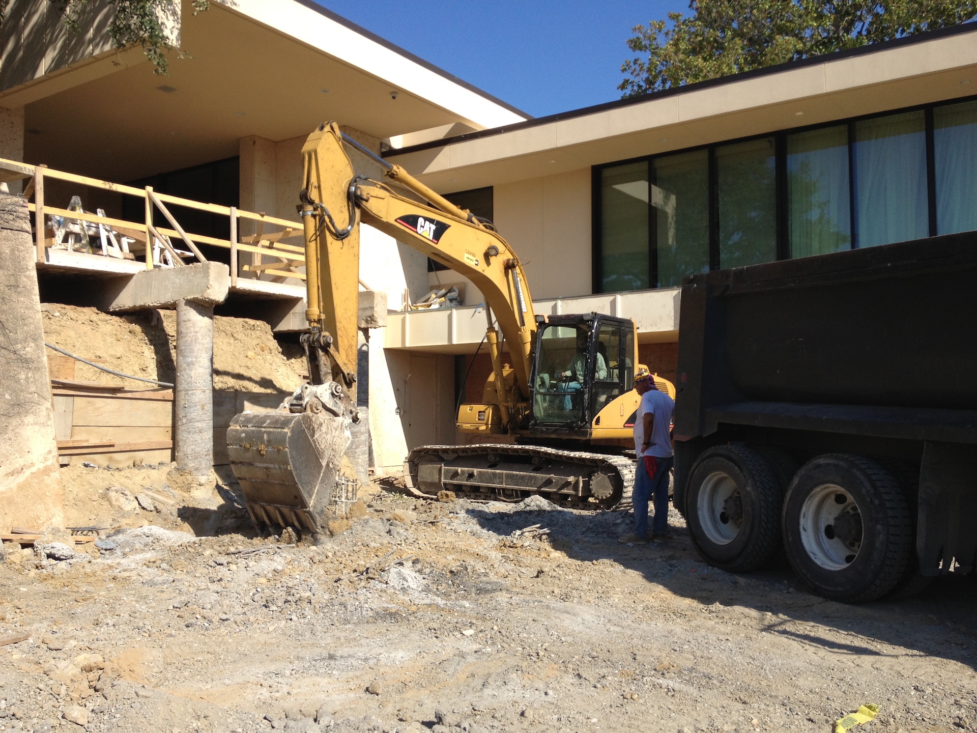 Excavation for concrete stairs and pool in progress.