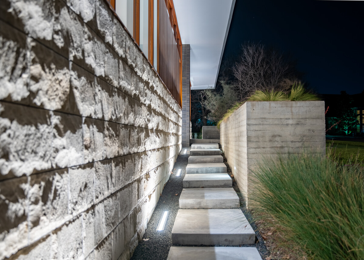 concrete paver walkway with landscape lighting