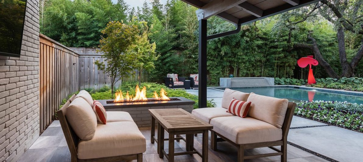 Fire pit beneath covered structure