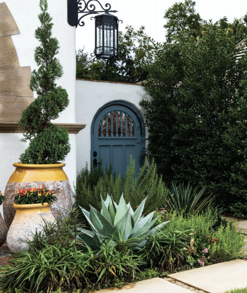 yellow architectural planters in a mediterranean garden