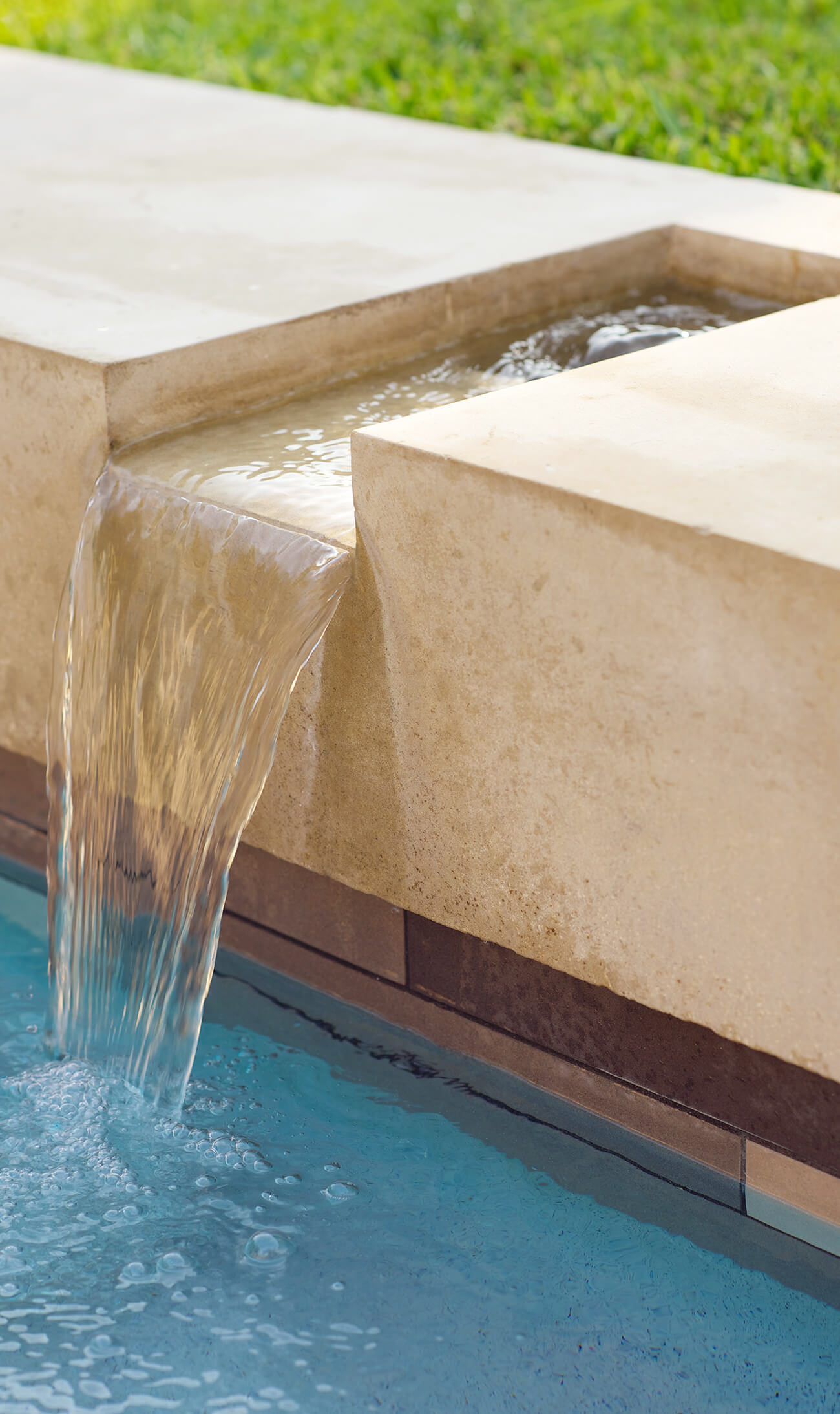 Dallas, TX - Closeup of Crestbrook limestone pool water feature