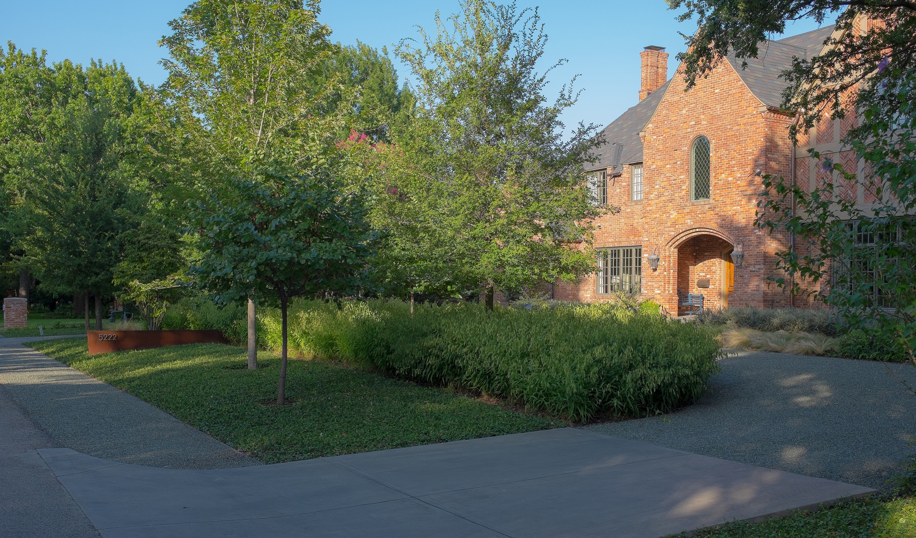 Front yard landscape design by Bonick Landscaping blends traditional and modern elements.