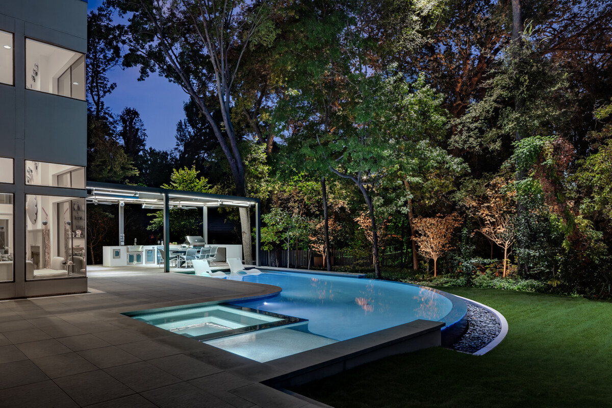 curved negative edge pool and outdoor living space