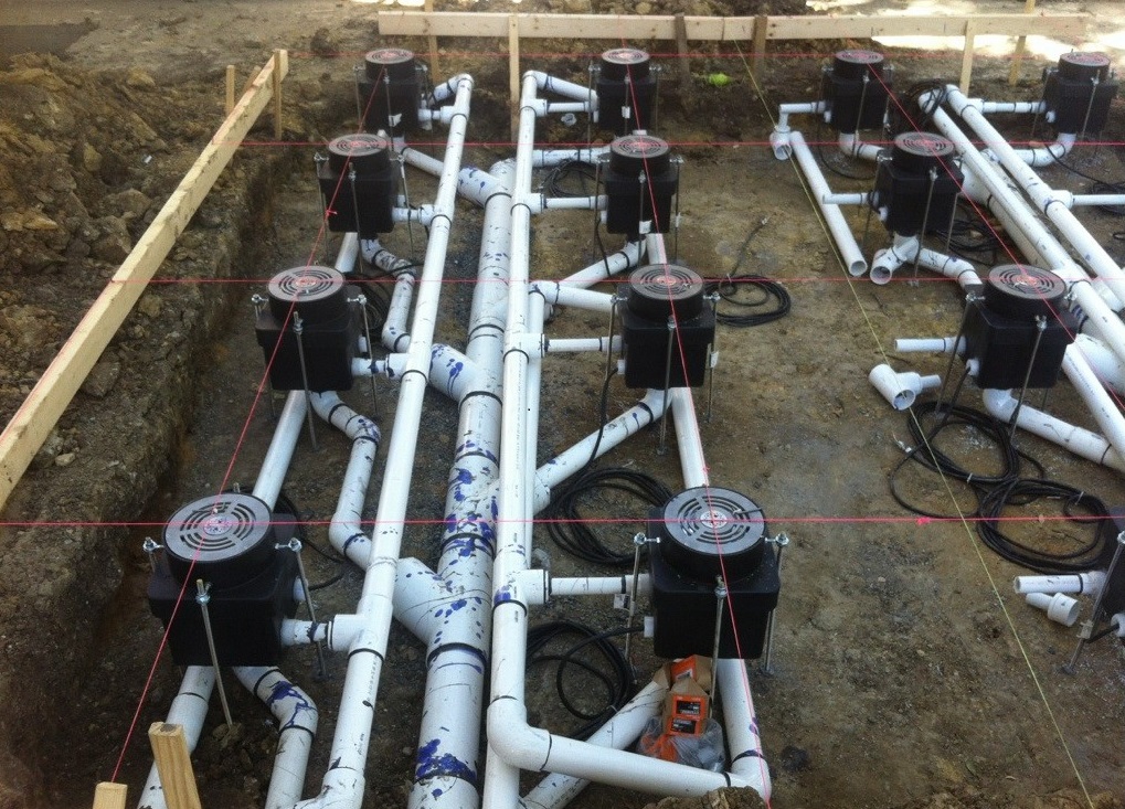 During construction - pumps and plumbing for dancing fountain with LED lights.