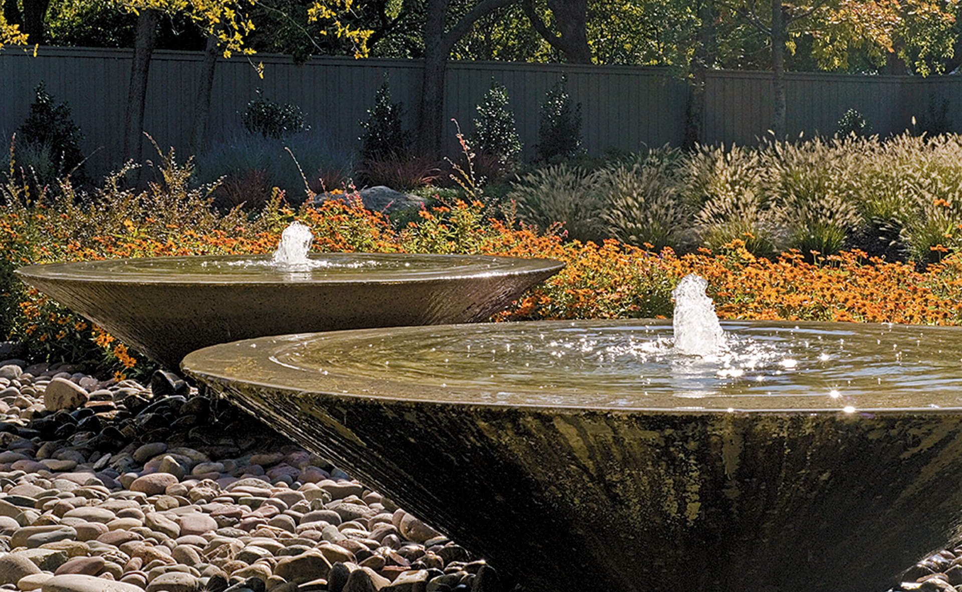 Dallas, TX - Concrete urns overflow into gravel