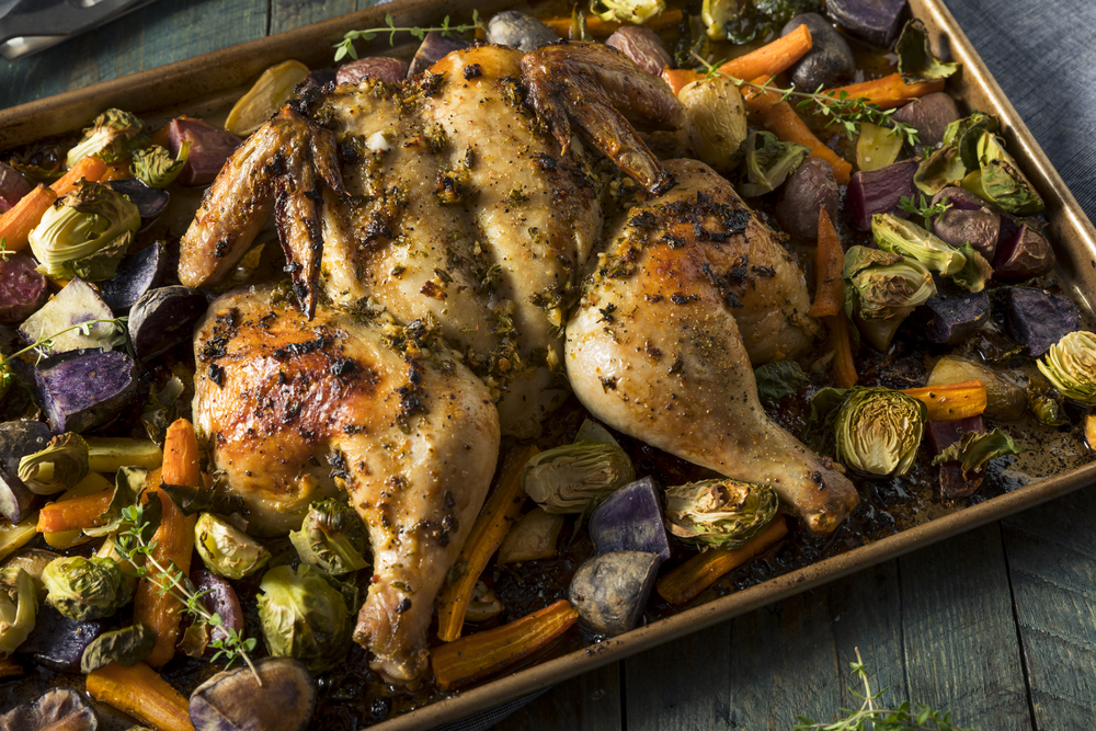 Spatchcock turkey with herbs and vegetables